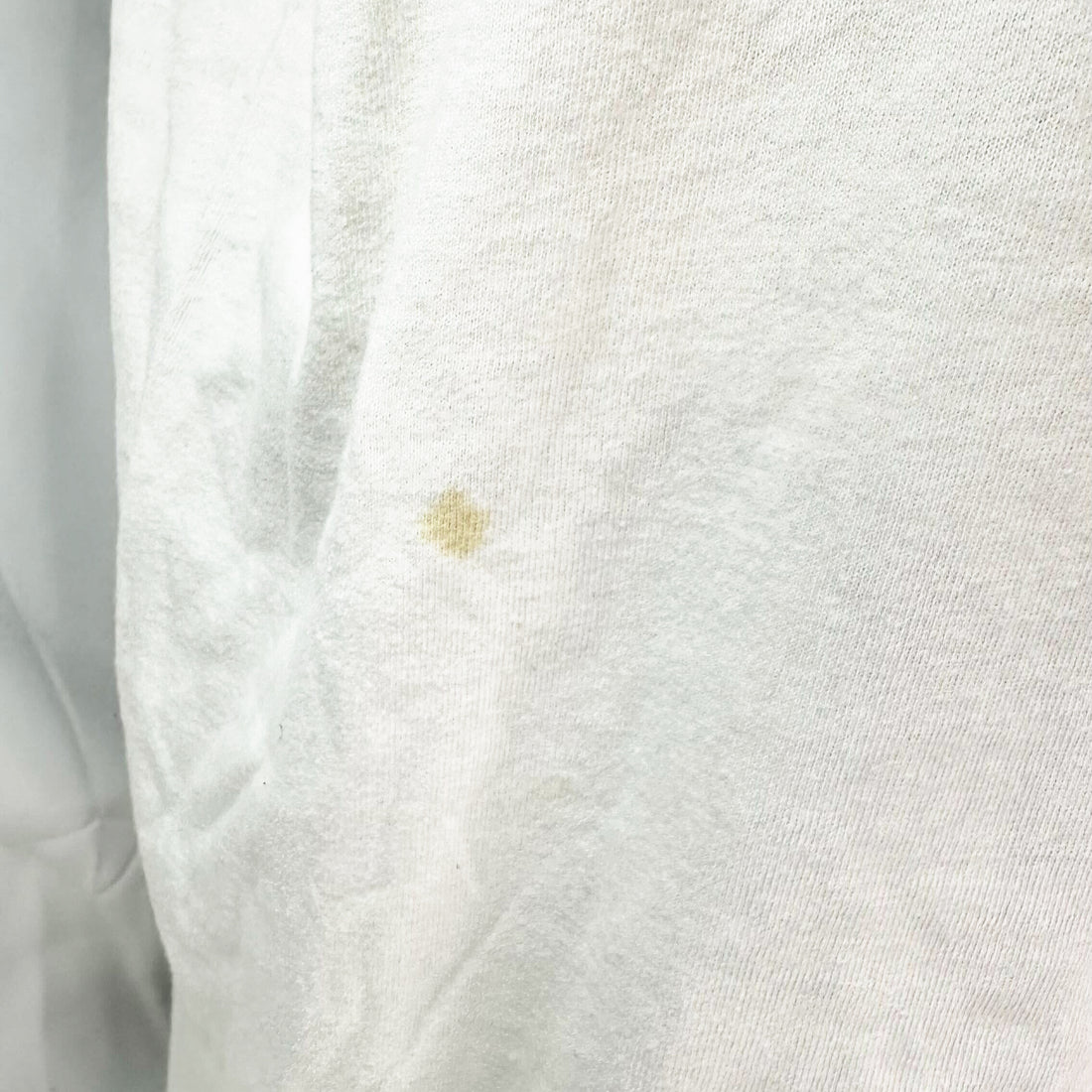 MELTING SMILEY FACE XL 前身頃の小さなシミ